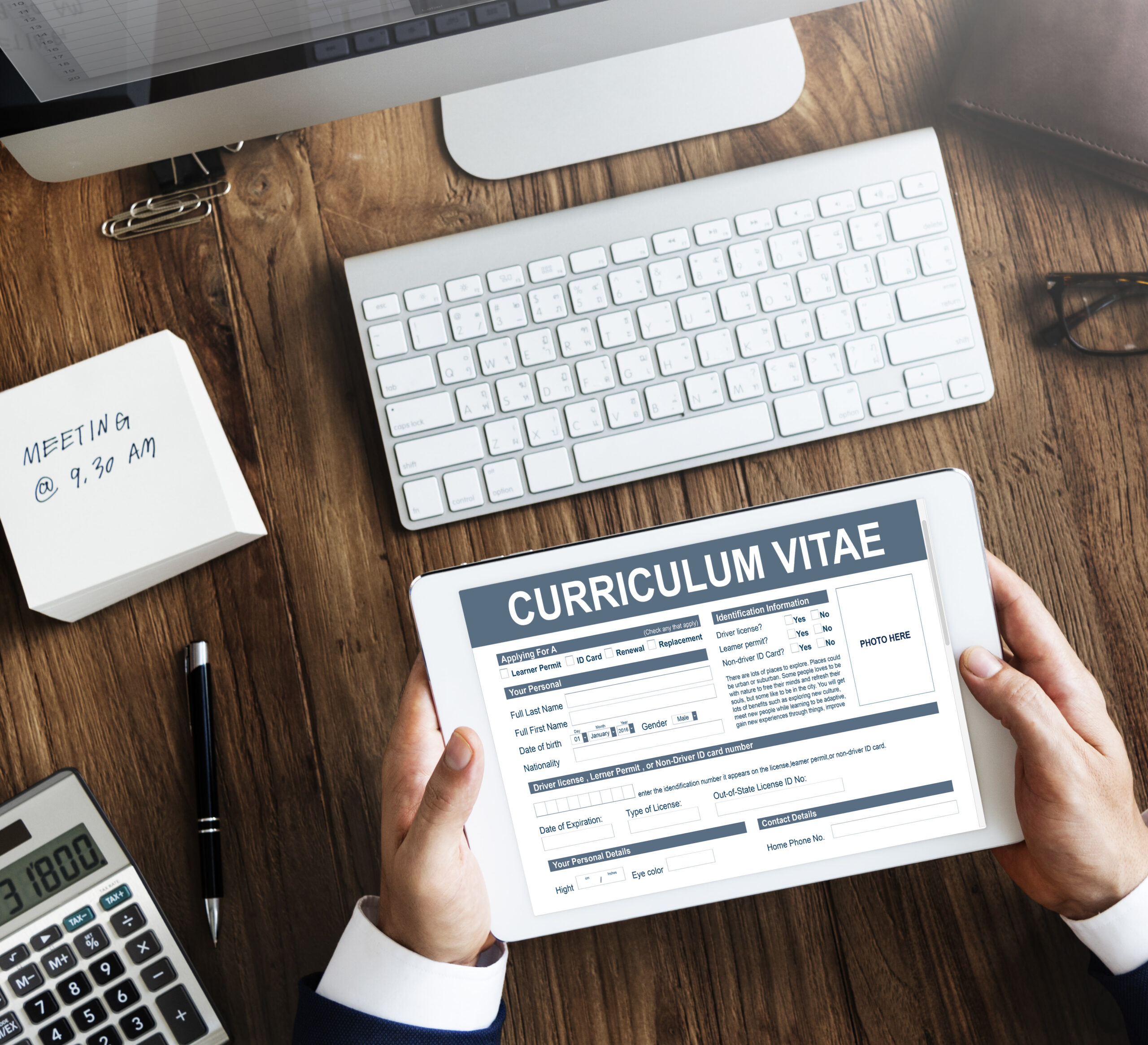 Curriculum Vitae and Resume on desk for LinkedIn profile and job application services