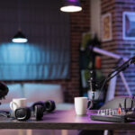 Home podcast studio setup with professional recording equipment and purple ambient lighting