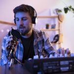 Voiceover artist working in a bedroom recording studio