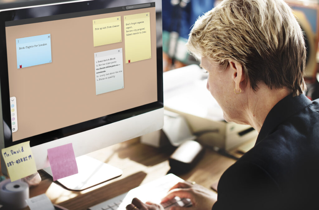 Notepad with handwritten reminder list for startup user testing and planning tasks