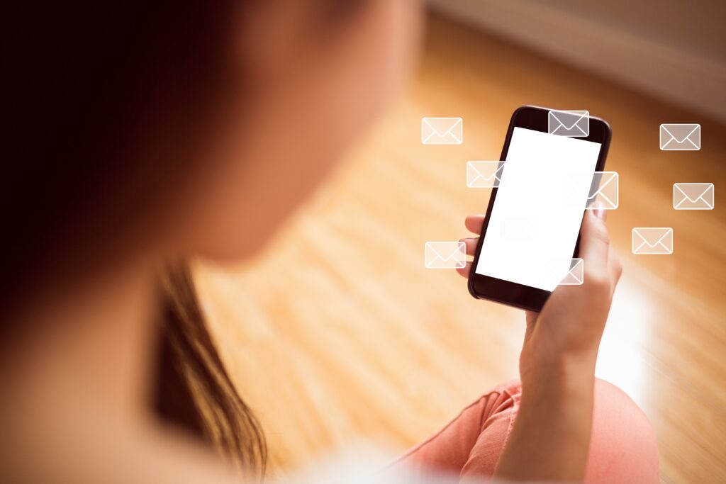 Graphic illustration of a business professional using the best text messaging service for business on a mobile phone and computer.