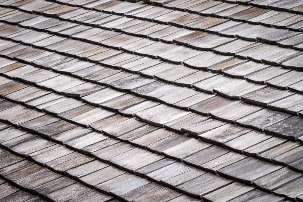 Close-up of asphalt roofing shingles installed by a local roofing company near me.