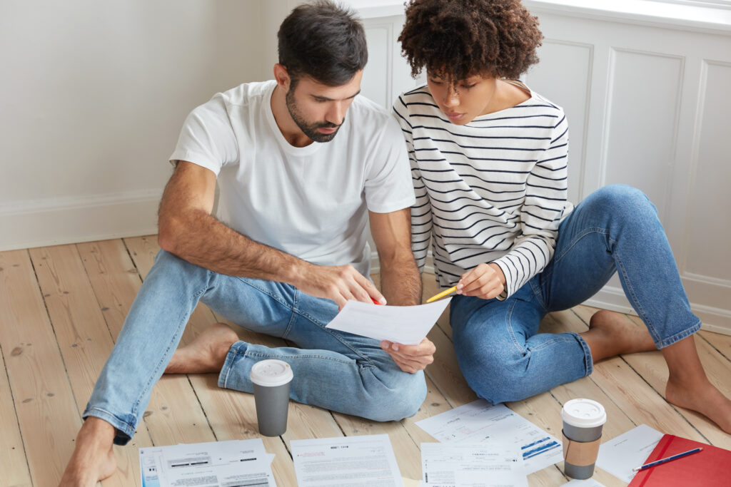 U.S. homeowner reviewing a written roofing estimate from a local roofing contractor.